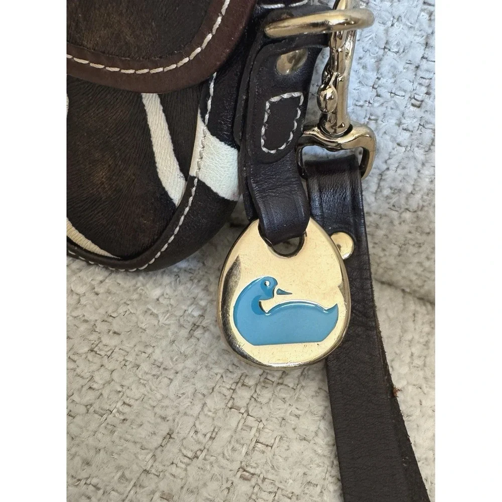 Dooney & Bourke Giraffe Print Haircalf Leather Flap Wristlet Bag Blue Logo Charm